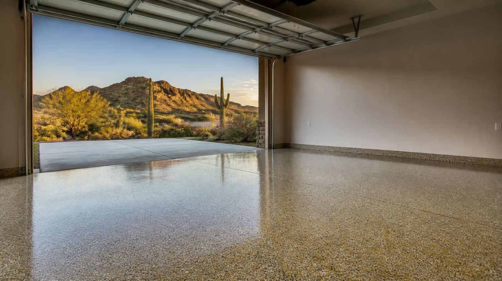 Sand flake garage floor opening onto saguaros and foothills